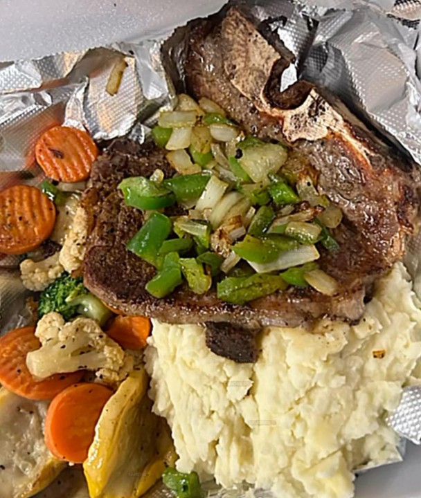 Steak and mashed potatoes with mixed veggies