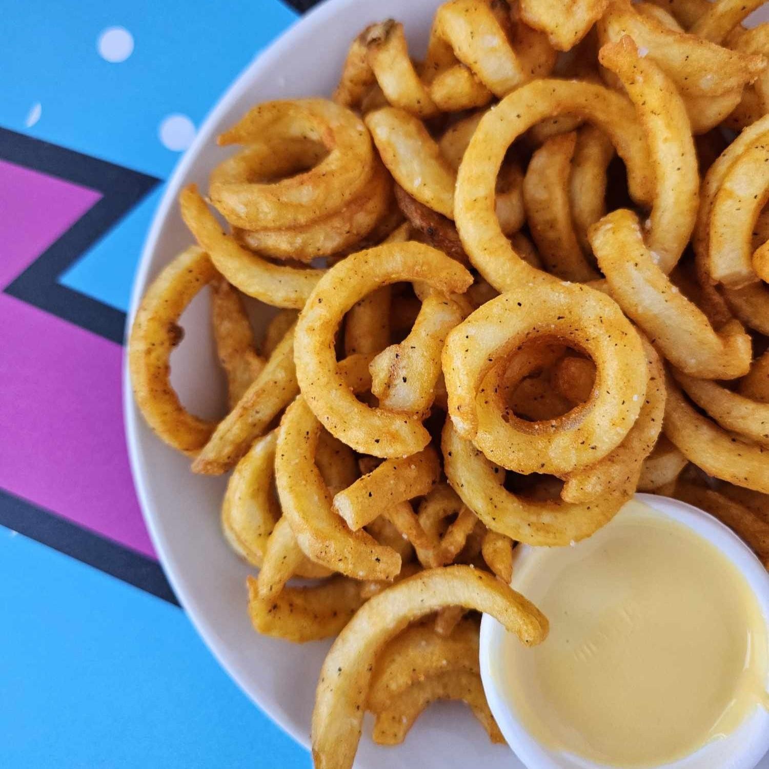 Curly Fries - Lightly Seasoned, Cheese Sauce