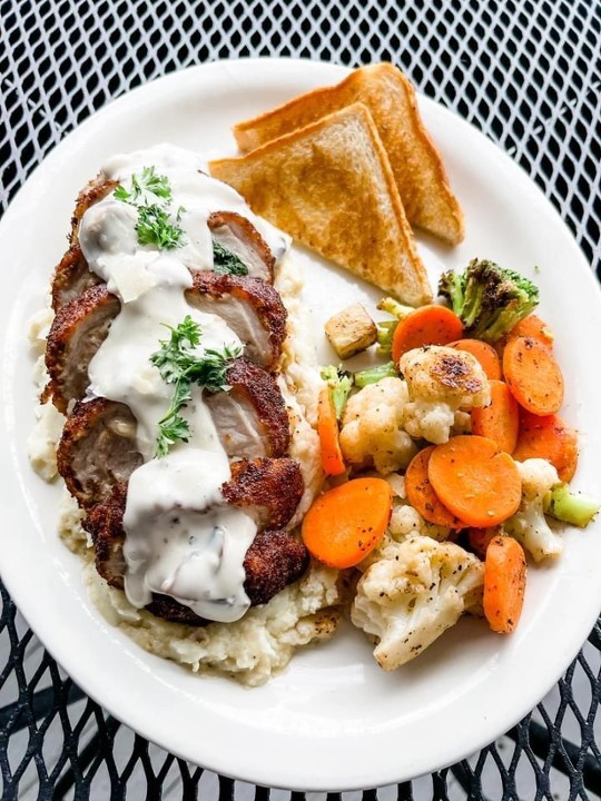 Stuffed Pork Chop over Mashed Potatoes