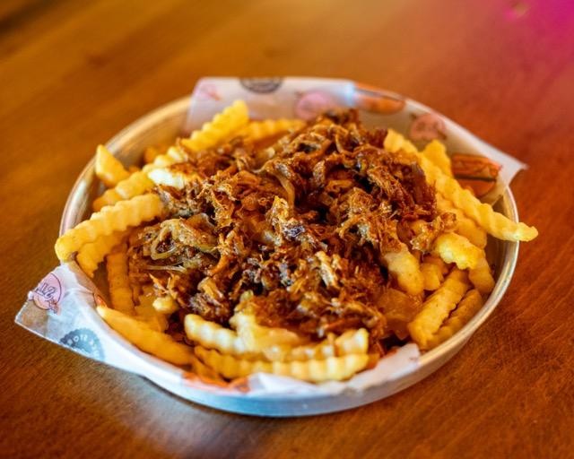 CRINKLE FRIES WITH CARAMELIZED ONIONS AND PULLED PORK