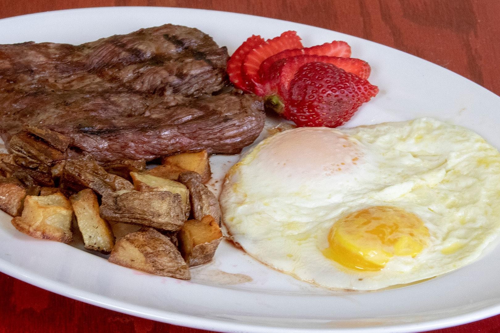 Strip Steak (8oz.) & two eggs with pancakes or toast