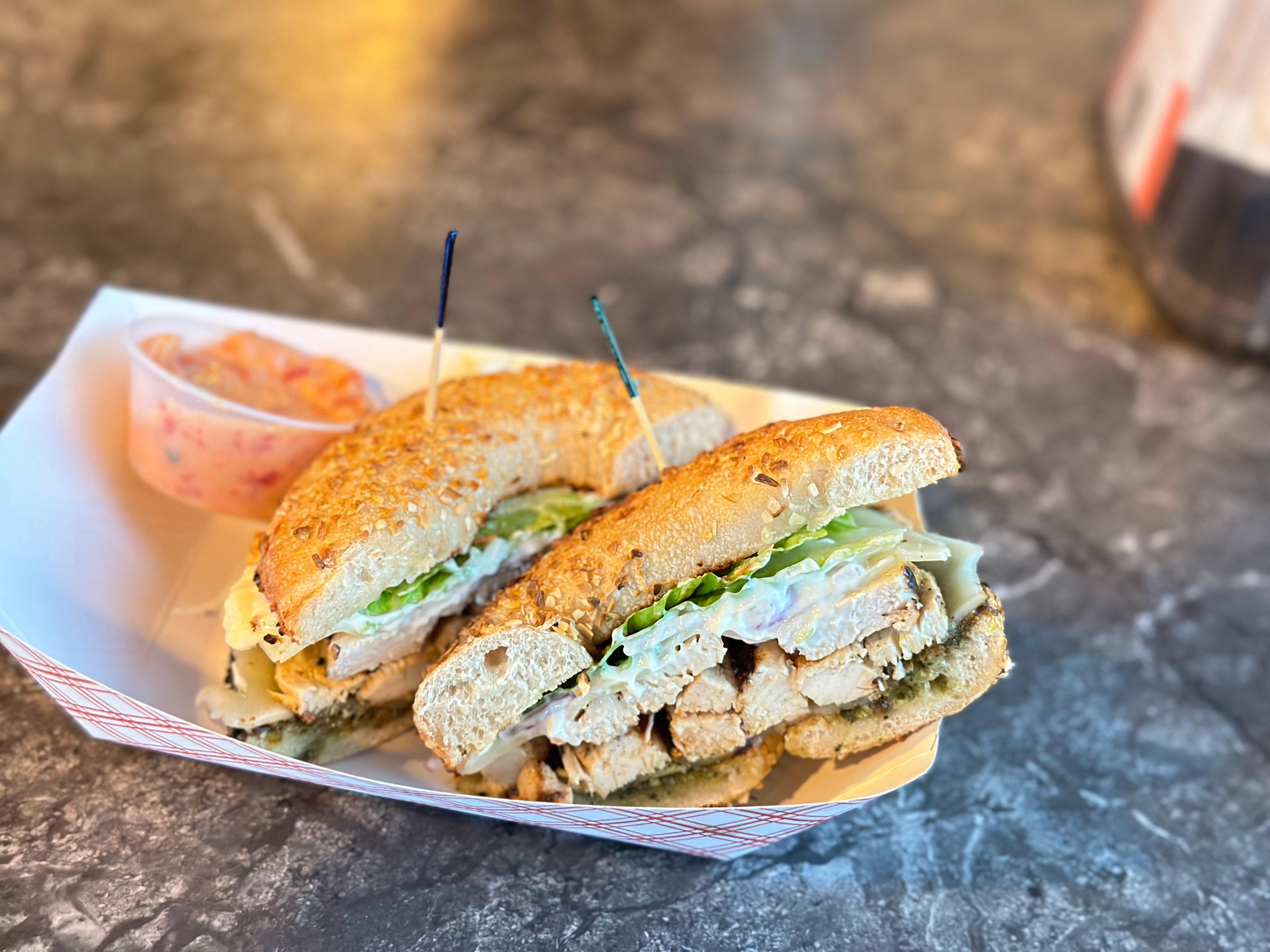 CHICKEN PESTO PROVOLONE BAGEL (grilled chicken, provolone, pesto, mayo, onions and lettuce on any choice of bagel)