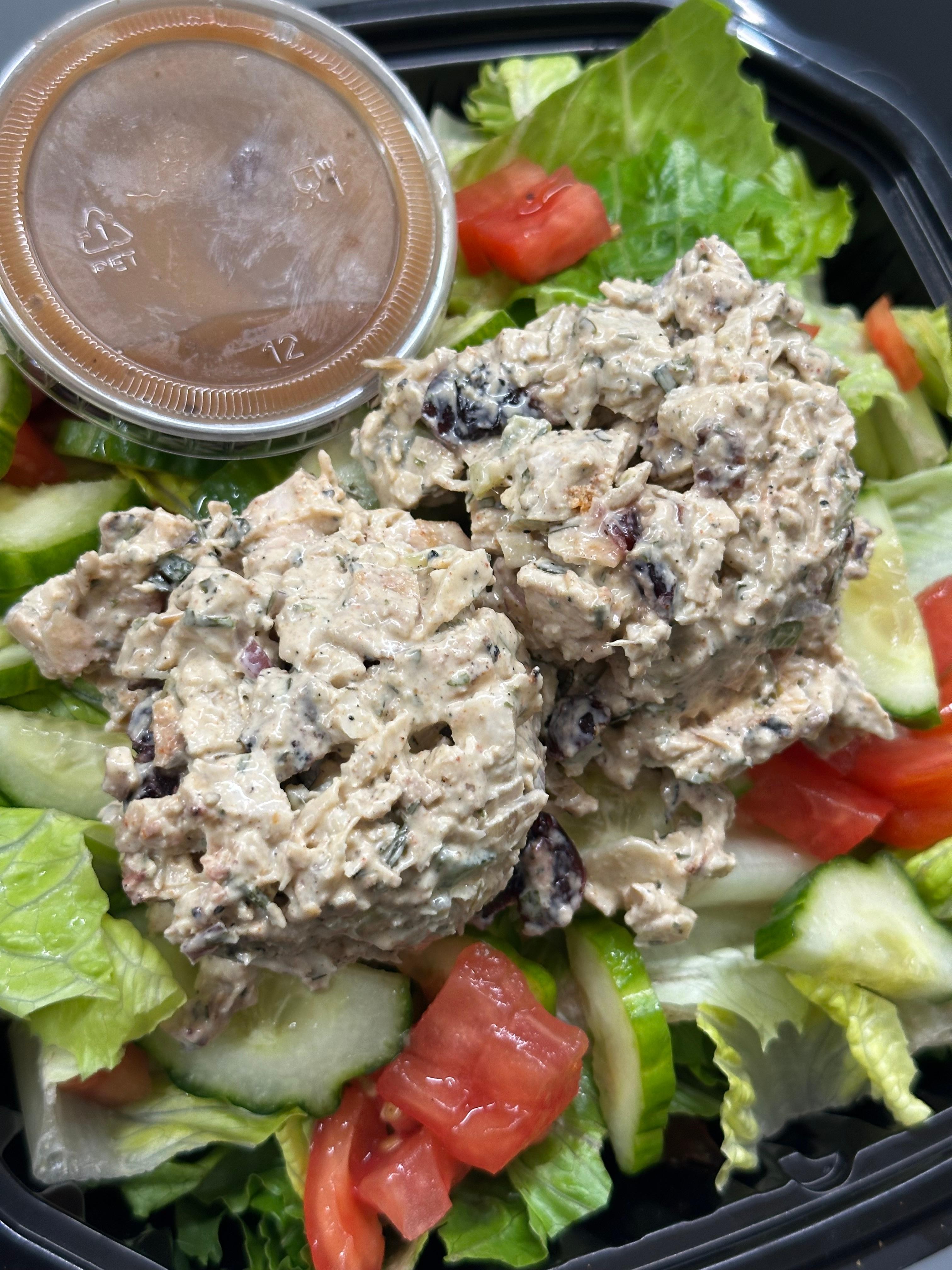 SALAD - CHICKEN SALAD (romaine, tomato, cucumbers, and 2 scoops of chicken salad made with almonds, onions and cranberries)