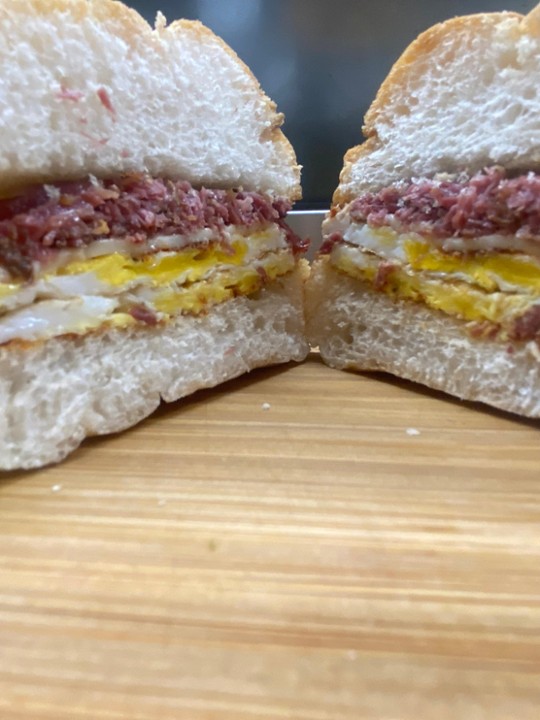 CORNED BEEF EGG & CHEESE (2 eggs, corned beef & american on hard roll)