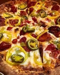 LAREDO pizza sauce, mozzarella, extra pepperoni, red onion, banana pepper, jalapeno, crushed red pepper, parmesan & oregano