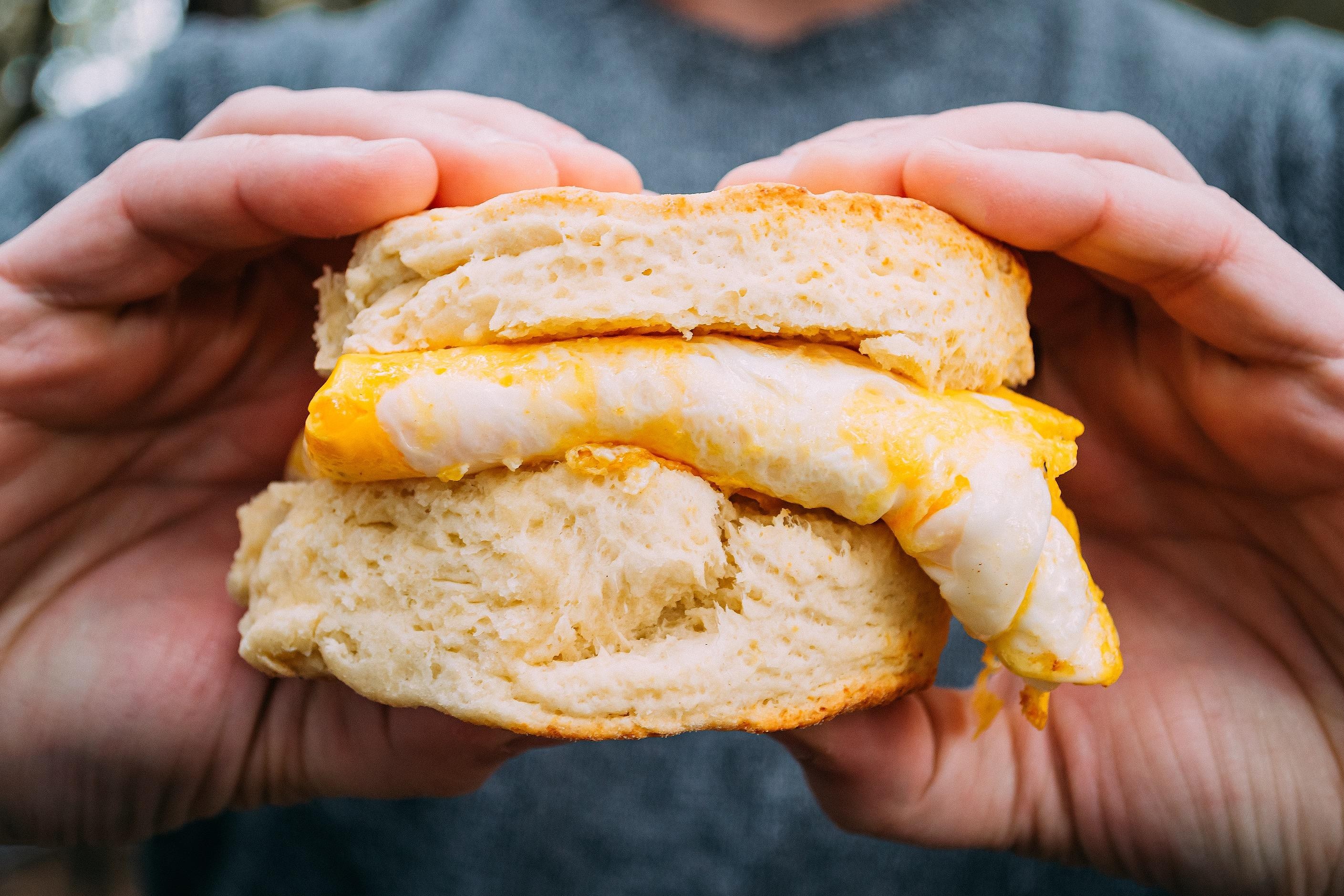 2 Eggs And Cheddar Cheese On A Biscuit