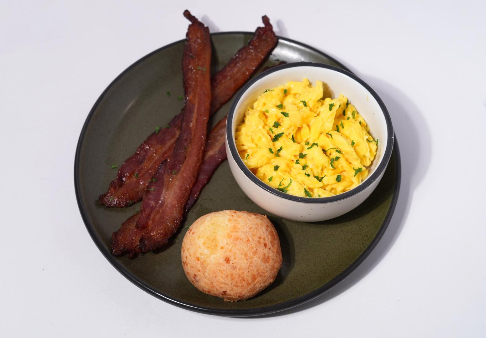 (1) pão de queijo | scrambled eggs | bacon or arugula salad
