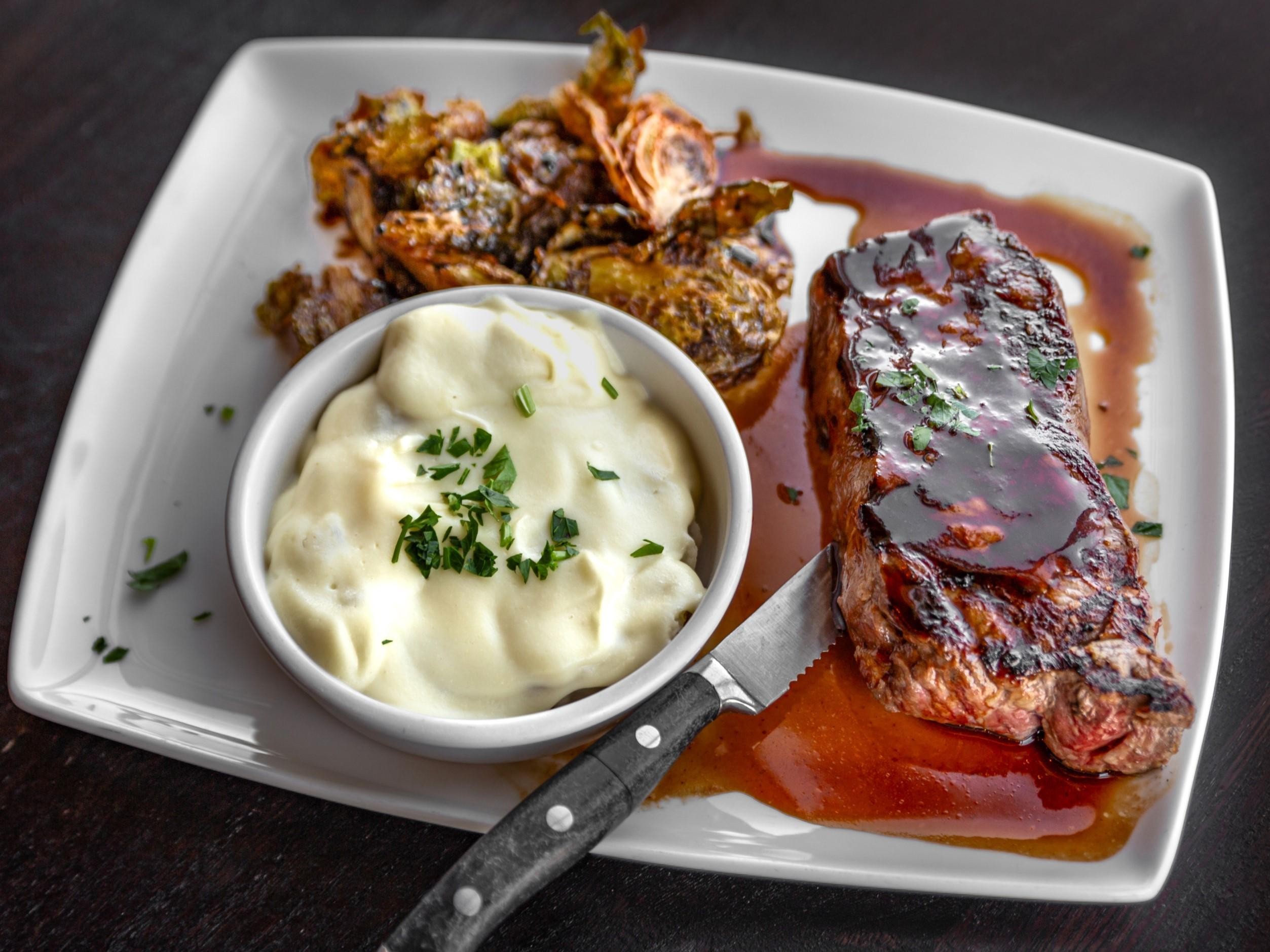 12oz. Smothered KC Strip Special
