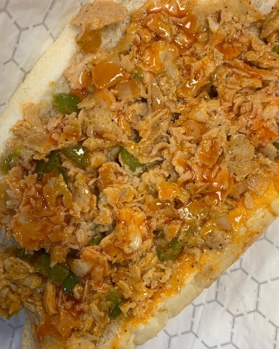 Buffalo Chicken Philly Cheesesteak with peppers onions and buffalo sauce (9oz of meat on a  Amoroso roll