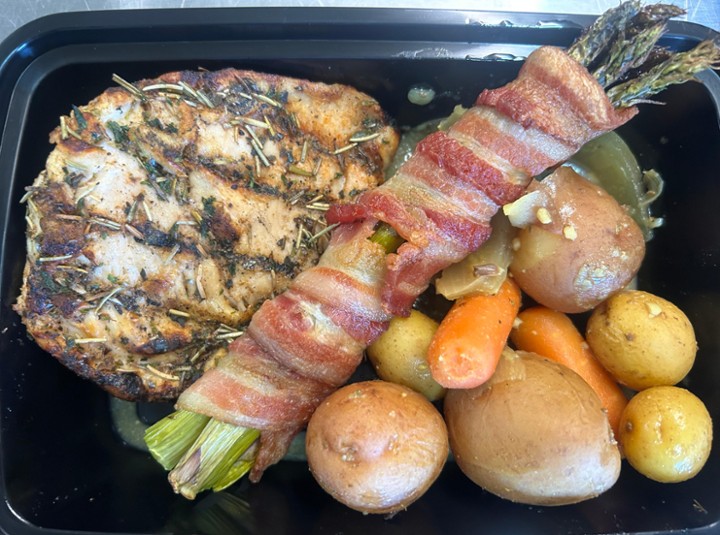 grilled chicken breast with potatoes, carrots and bacon wrapped asparagus