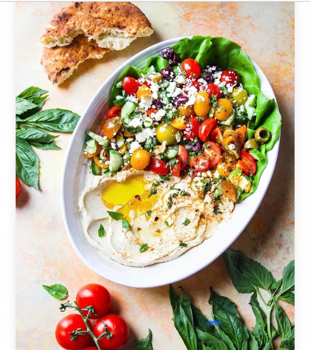 Mediterranean Hummus Salad with Grilled Chicken-Grilled Chicken, Hummus, spinach, cherry tomatoes, cucumbers, feta cheese, black olives, paprika, dried oregano, salt & Pepper , olive oil