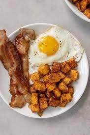 1 FRIED EGG, HOME FRIES, 2 BACON OR 2SAUSAGES