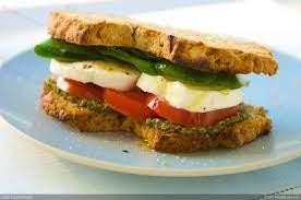 Fresh Mozzarella Basil Pesto Sandwich --Basil Pesto, Fresh Mozzarella, tomato, and spinach on bread.