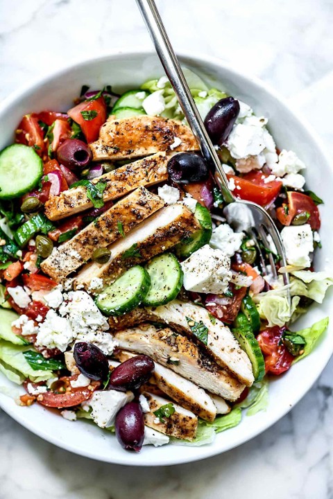 CRISPY CHICKEN GREEK SALAD- with breaded chicken , cucumbers, red onion, black olives , cherry tomatoes , Feta cheese , avocado , vinaigrette dressing