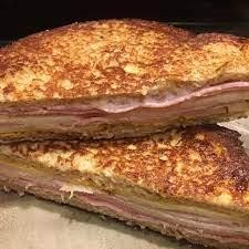 MONTE CRISTO-HAM, TURKEY AND SWISS CHEESE ON FRENCH TOAST.