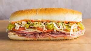 ITALIAN SUB -with ham, salami, provolone cheese, onions,  lettuce, tomatoes on a sub roll