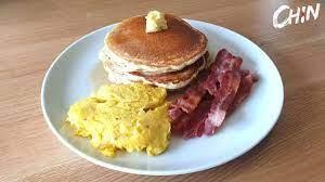 SCRAMBLES EGGS , MINI PANCAKE, AND 2 BACON