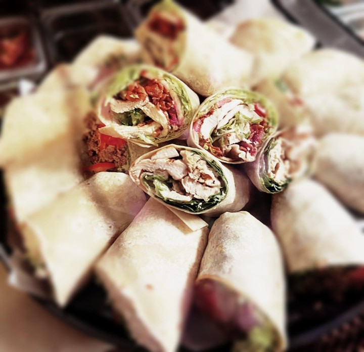 Any 10 wraps of choice served in a circular  tray cut in half