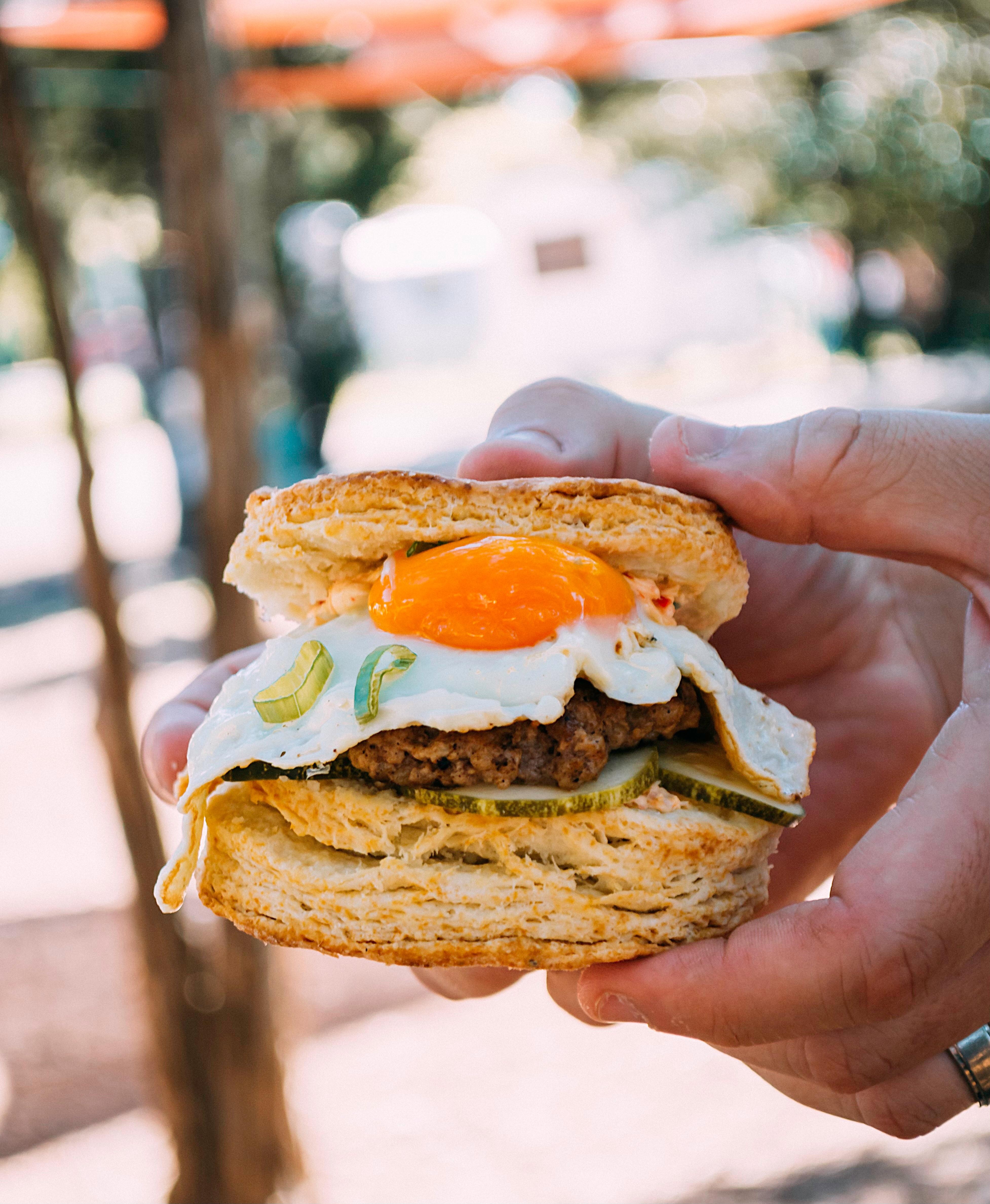 Fennel Sausage, Charred Fresno Pimento, House Pickles, Sunny Egg, on our Whey biscuits