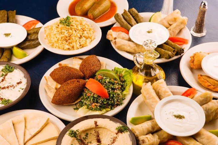 Lebanese Cuisine Aileen - 5 Stuffed Grape Leaves with white sauce