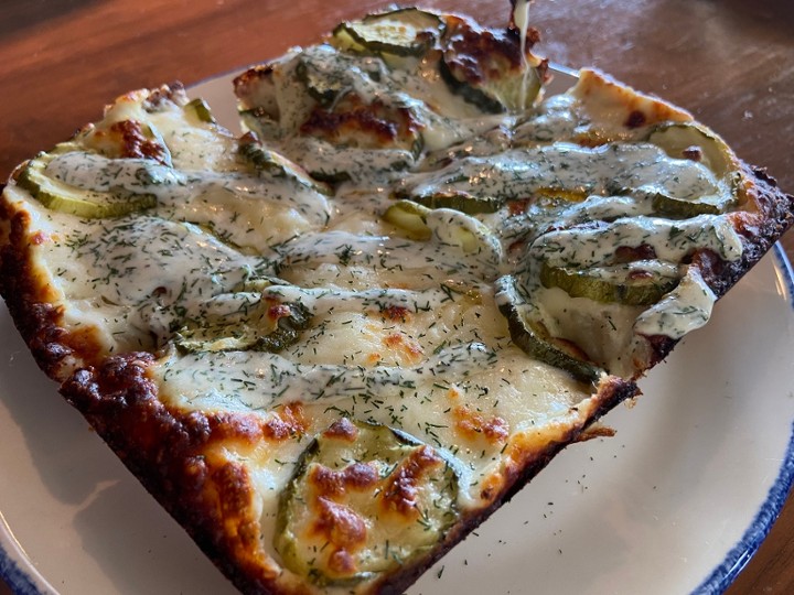 pizza: dill pickle with alfredo sauce (v)