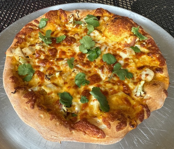 Slice of Butter Chicken with Cauliflower Pizza