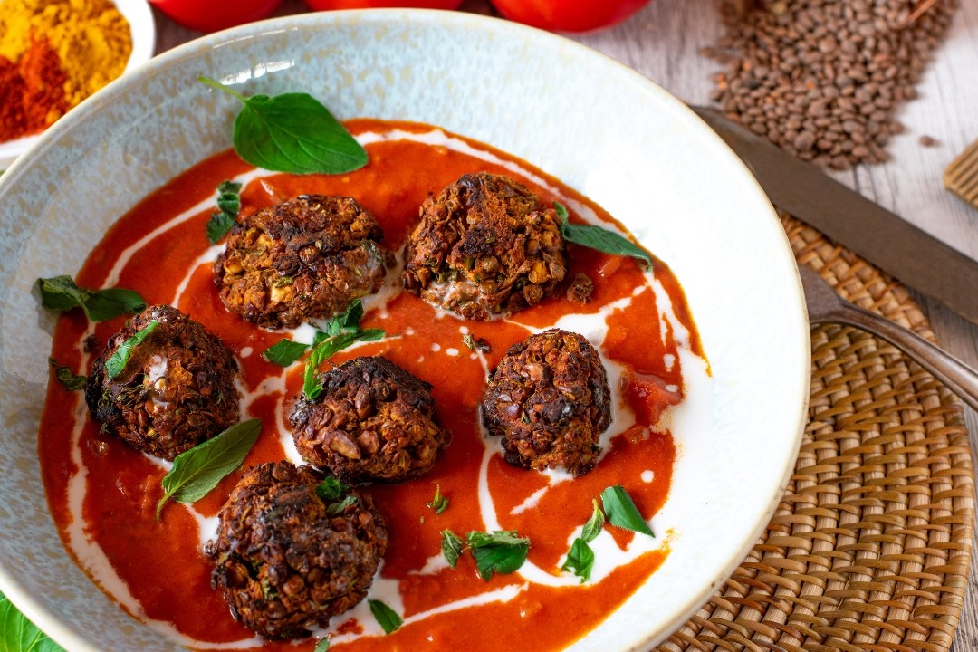Eggplant & Chickpeas meatballs in roasted red pepper sauce, coconut drizzle