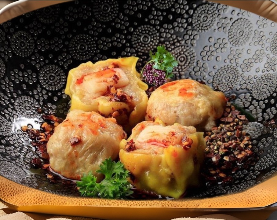 Steamed Chicken & Shrimp Dumplings In Chili Oil (kanom Jeeb)