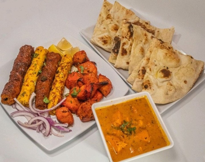 # 2 Kebab and Curry Combo - 8 pc Tandoori Chicken Tikka 1 Boti Kebab Beef 1 Boti Kebab Chicken 1 lamb boti 1 Curry your choice 3 Naan, Rice, Salad & Sauces