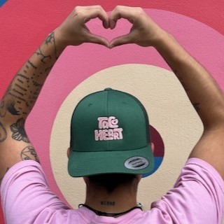 Pink Logo on Green Cap