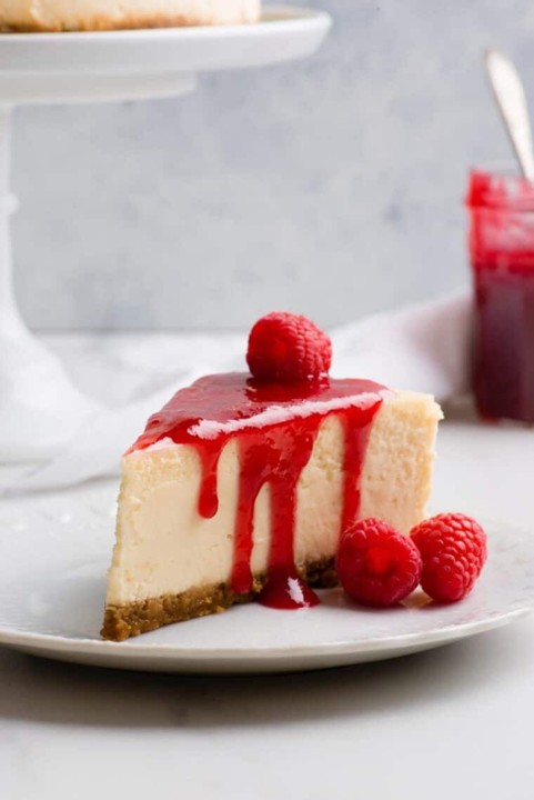 Cheesecake w/Raspberry Sauce & whipped cream