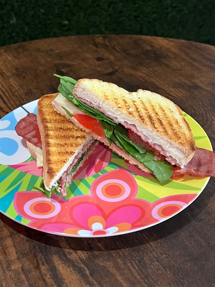 Basic Love Panini- Sometimes simply is best. This panini is served with turkey bacon, white american cheese, spinach & tomato grilled to perfection on Italian bread **optional avocado mash