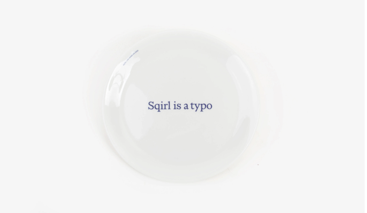 Sqirl is a typo 9" Plate