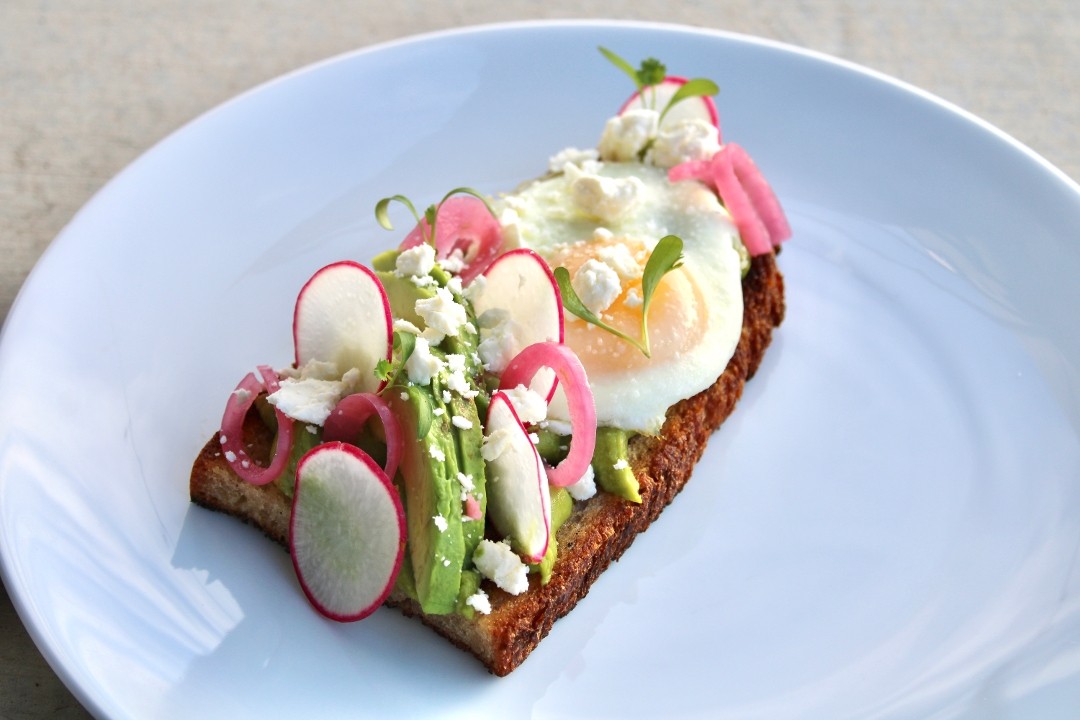 AVOCADO TOAST + Forms of Avocado + Over Medium Egg + Noble Country Loaf + Feta + Radish + Pickled Red Onion