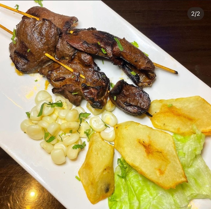ANTICUCHOS CON CHOCOLO & PAPA DORADA / GRILLED COW HEART SKEWERS, CORN & BOILED POTATOTOES