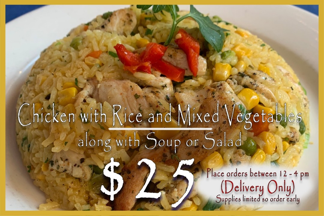 Chicken sauteed with yellow rice and corn