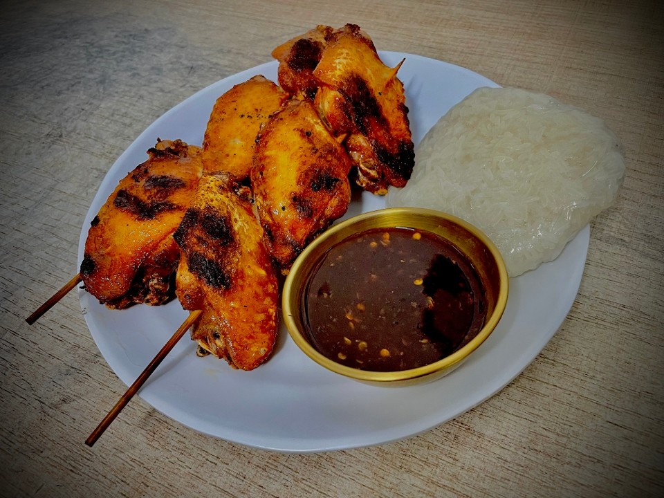 E1.  Grilled chicken wings with sticky rice (2 skewers)