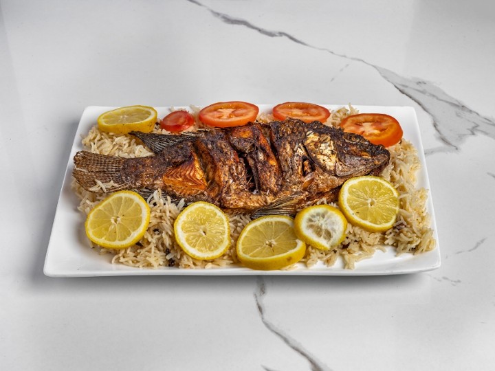 whole fish with rice and salad