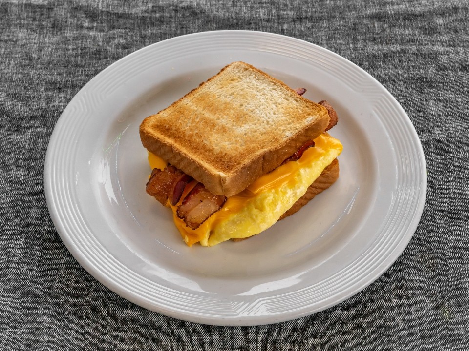 House Breakfast Sandwich (Eggs, crispy bacon, hash brown, cheese)