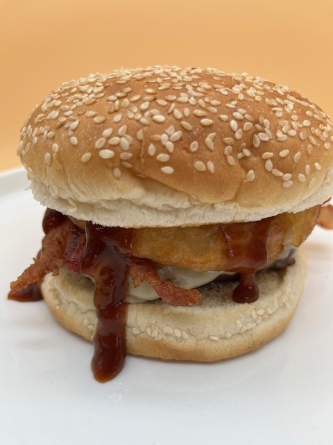 100% angus beef Western cheeseburger (bacon, onion rings, and BBQ sauce)