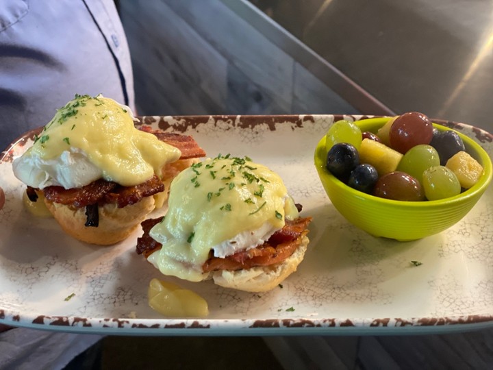 Bakn Eggs Benedict served with Fruit