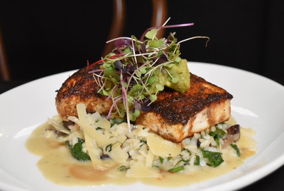 Ruby's Oyster Bar & Bistro - Blackened Swordfish Medallions over Pear Salad