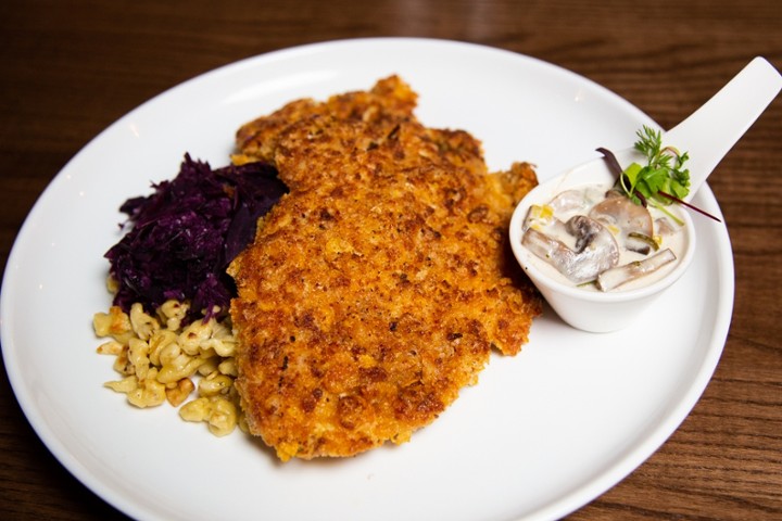 Schnitzel choice of pork/chicken pan seared with 2 side your choice