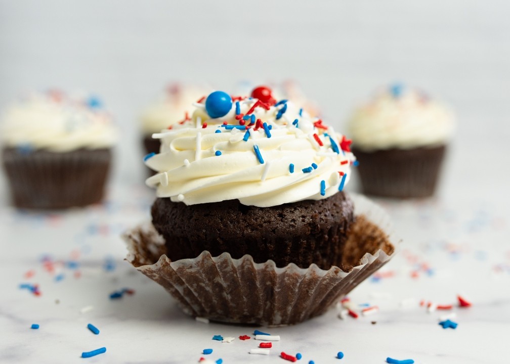 chocolate cupcake with red, white, + blue sprinkles