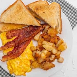TWO EGGS with Home Fries, White Toast, & Jelly (substitute wheat .30 cent and rye -.40cents, english muffin - .40 cents, bagel - .60 cents, croisant - .75 cents)