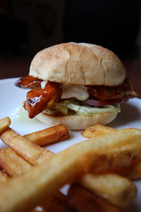 Grilled Rosemary Chicken Sandwich - Traditional Roll, Grilled Chicken, Decades Hot Sauce, Greek Aioli, Lettuce, Red Onions