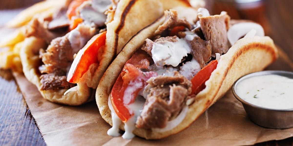 ASTORIA gyro!  Our delicious sliced gyro meat in our soft pita, topped with our tzatziki sauce, tomato, red onion and shredded lettuce