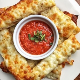 GARLIC BREAD our italian loaf with garlic butter & side of marinara