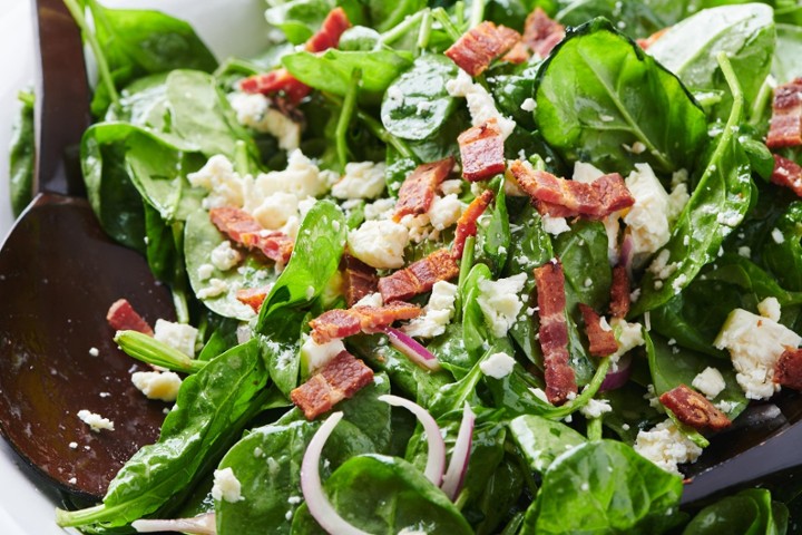 SPINACH tossed with bacon, red onion and mozzarella