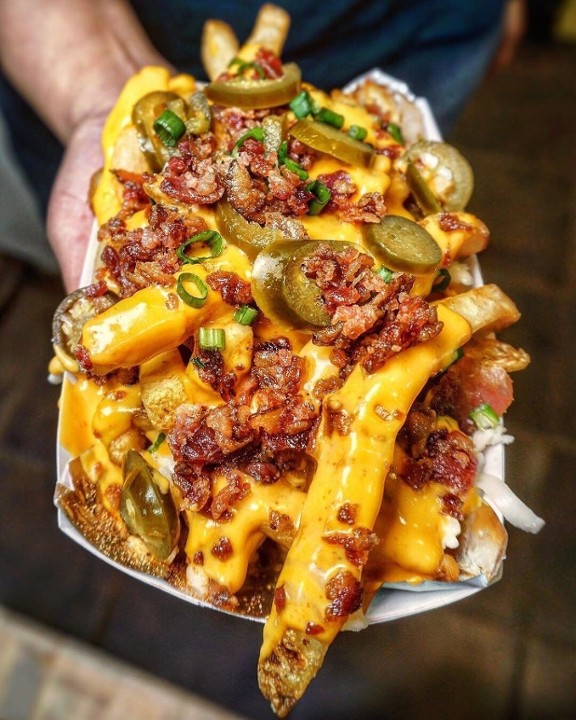 FRIES, LOADED mozzarella & cheddar topped with bacon & served with sour cream